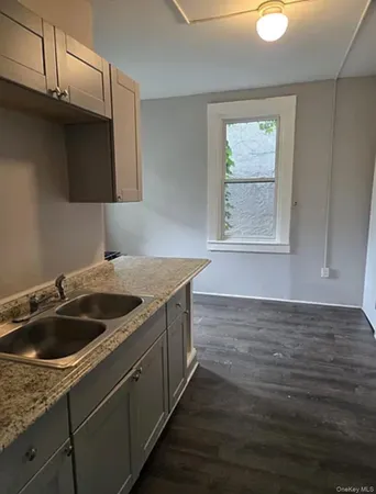 a kitchen with a sink and cabinets