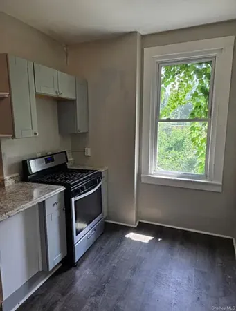 a kitchen with a stove and a sink