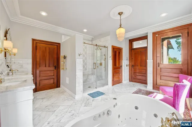 a bedroom with a bed and a dresser next to a window