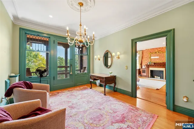 a bedroom with bed and a large window