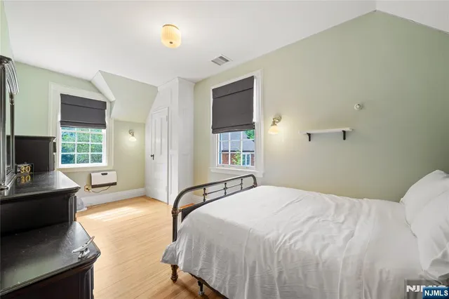 a bathroom with a sink a mirror and a shower