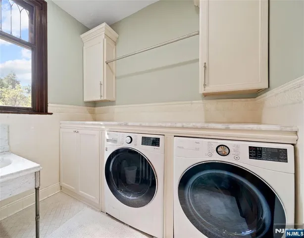 a bathroom with a tub and a sink