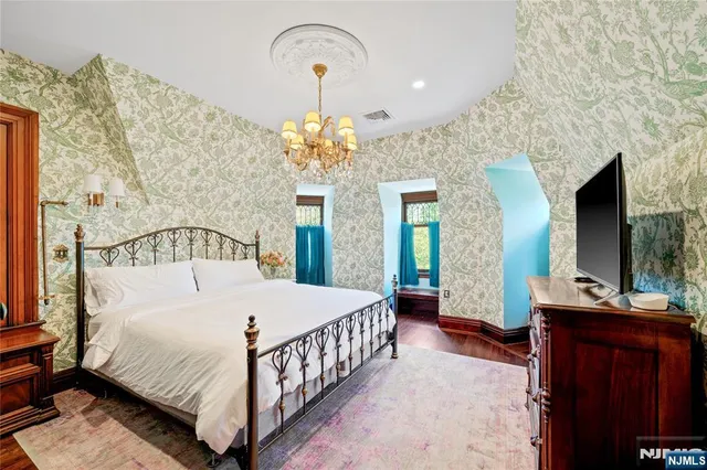 a living room with fireplace furniture and a flat screen tv