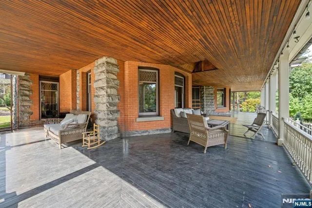 an aerial view of a house with garden space and street view