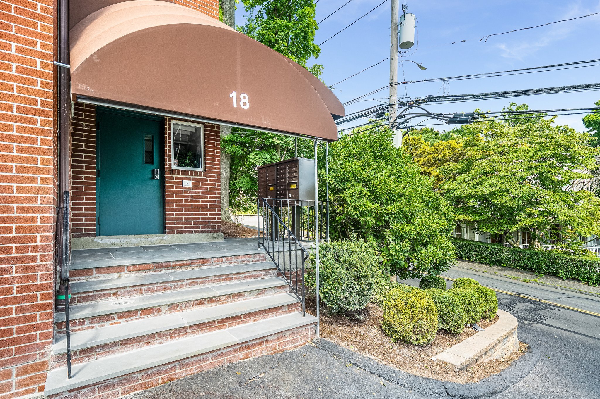 18 Fairfield Avenue, Unit A7 Norwalk, CT 06854 - Photo 11 of 11 a front view of a house with a yard