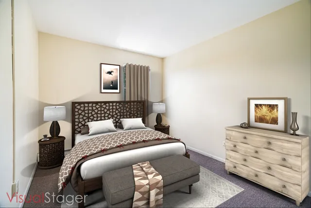 a bedroom with a bed and dresser