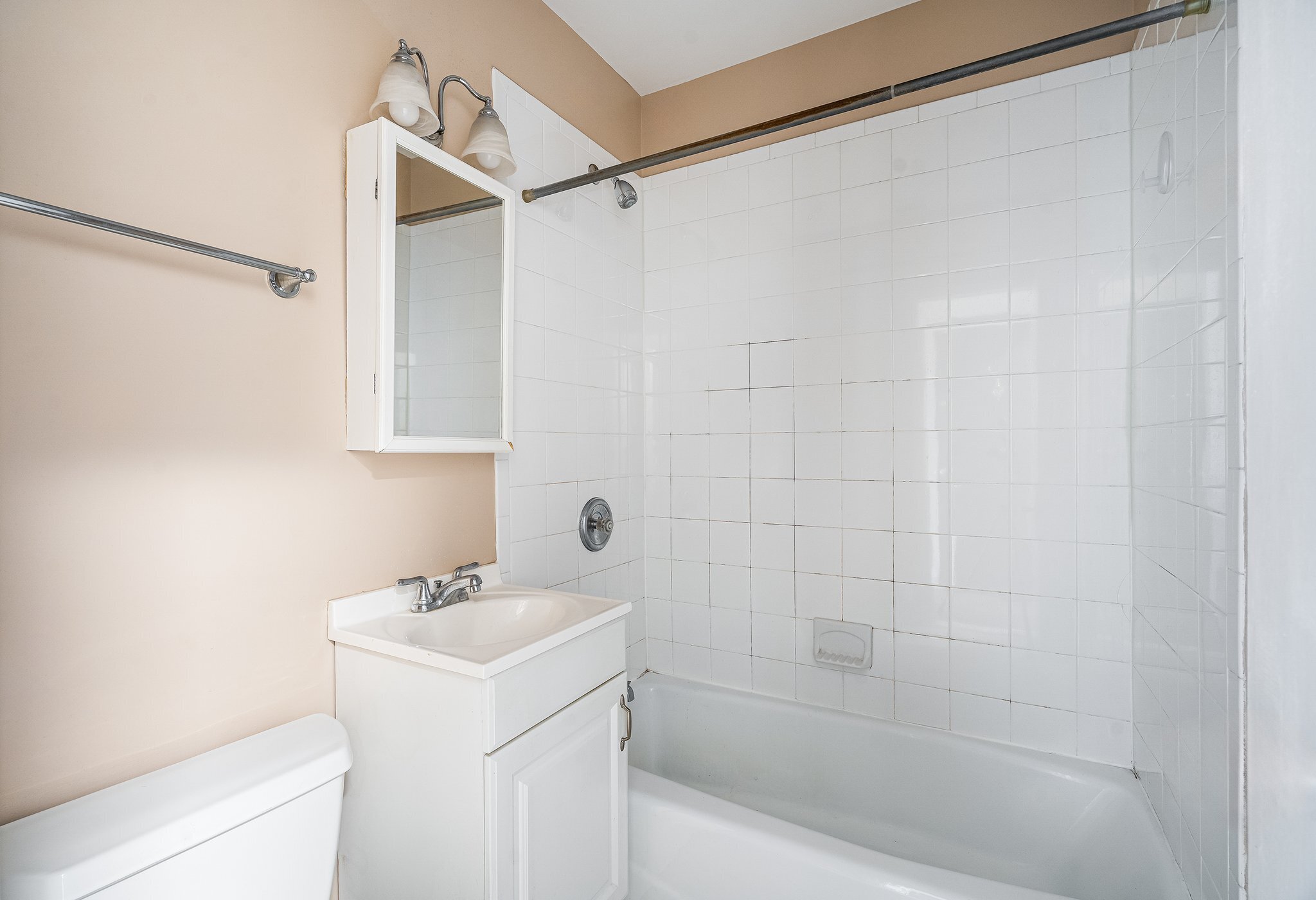 18 Fairfield Avenue, Unit A7 Norwalk, CT 06854 - Photo 7 of 11 a bathroom with a sink a mirror and a shower