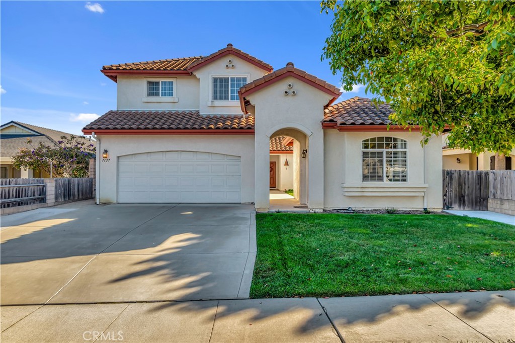 a front view of a house with a garage