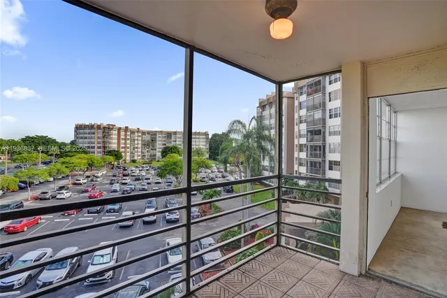 a view of a glass door with a balcony