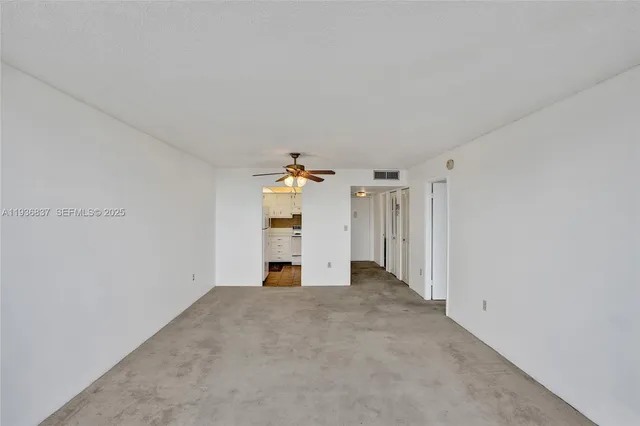 a view of a chandelier fan in a room