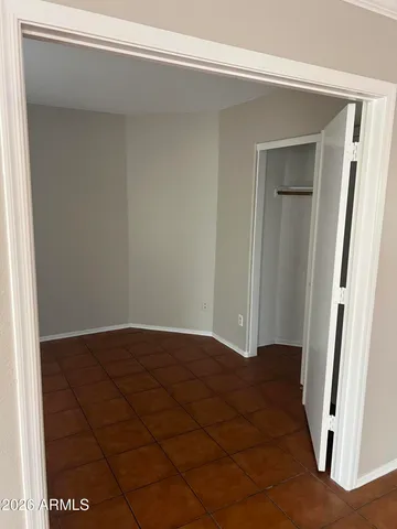 a view of a backyard with large trees