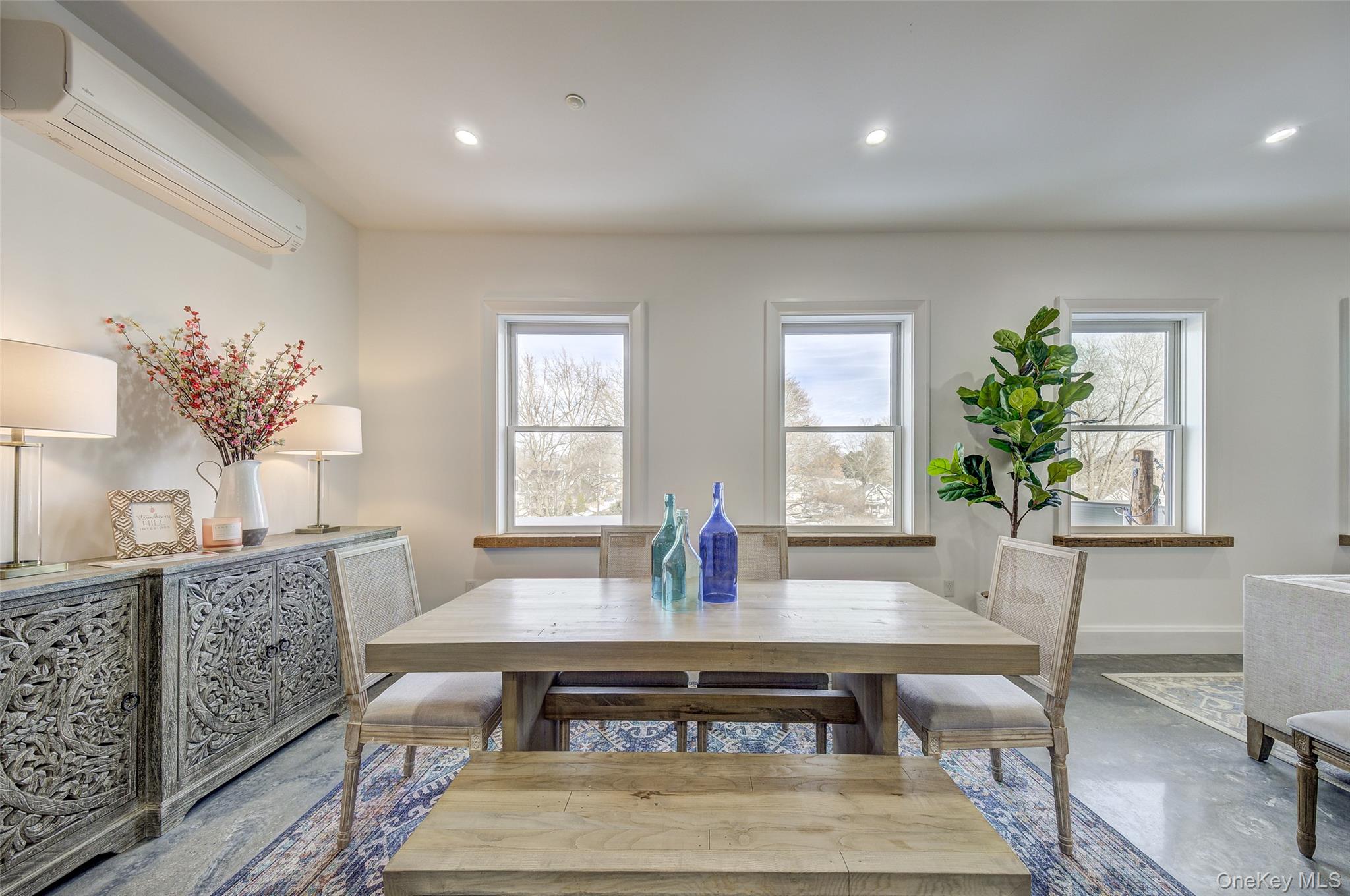 226 Main Street, Unit 302 Beacon, NY 12508 - Photo 11 of 43 Dining room with a wall mounted AC, finished concrete floors, and recessed lighting