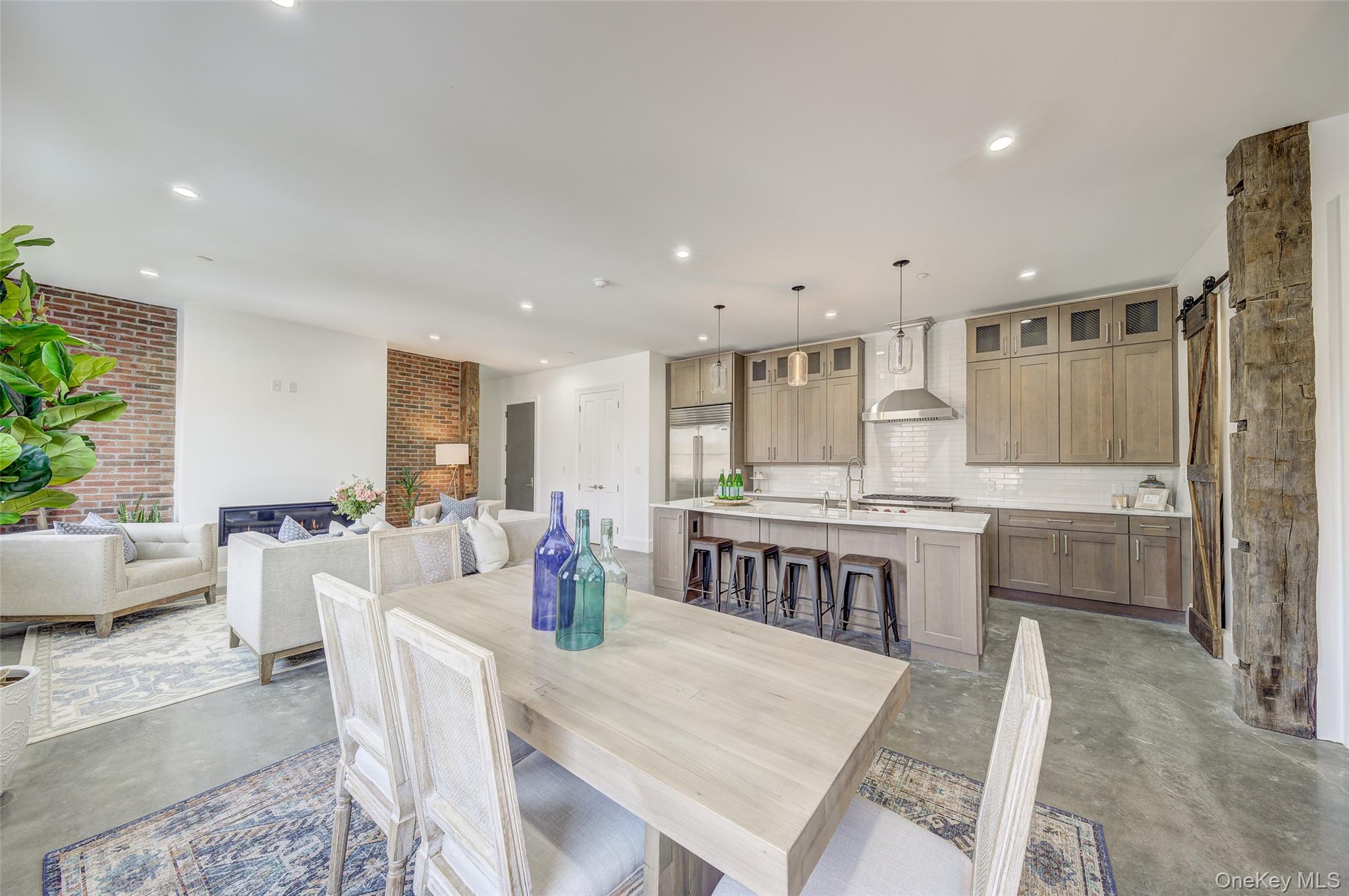 226 Main Street, Unit 302 Beacon, NY 12508 - Photo 18 of 43 Dining room featuring concrete floors, a barn door, and recessed lighting