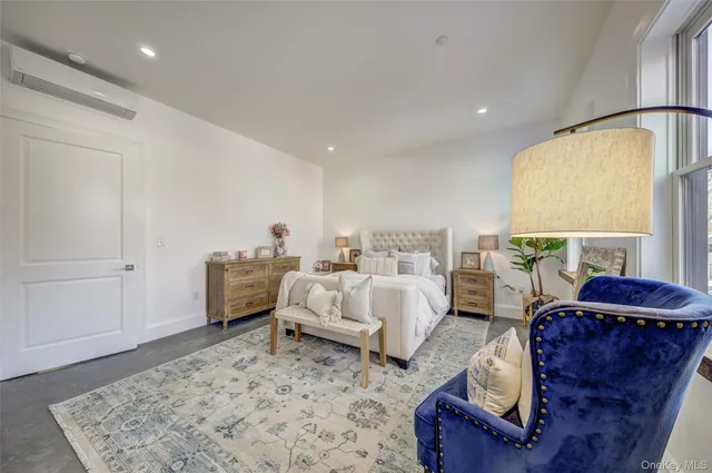 a bed room with furniture and a window