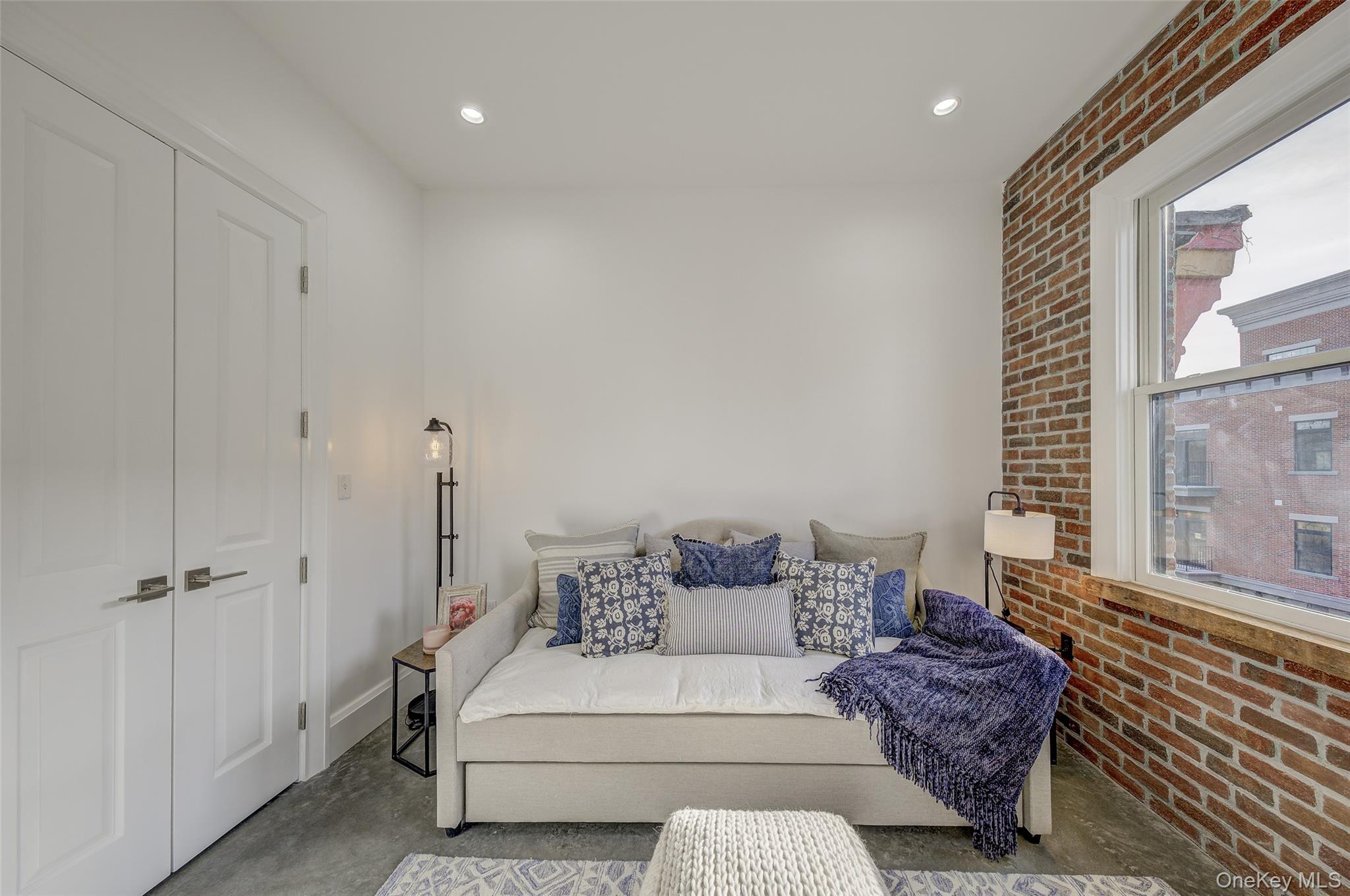 226 Main Street, Unit 302 Beacon, NY 12508 - Photo 40 of 43 Sitting room featuring brick wall, concrete flooring, and recessed lighting