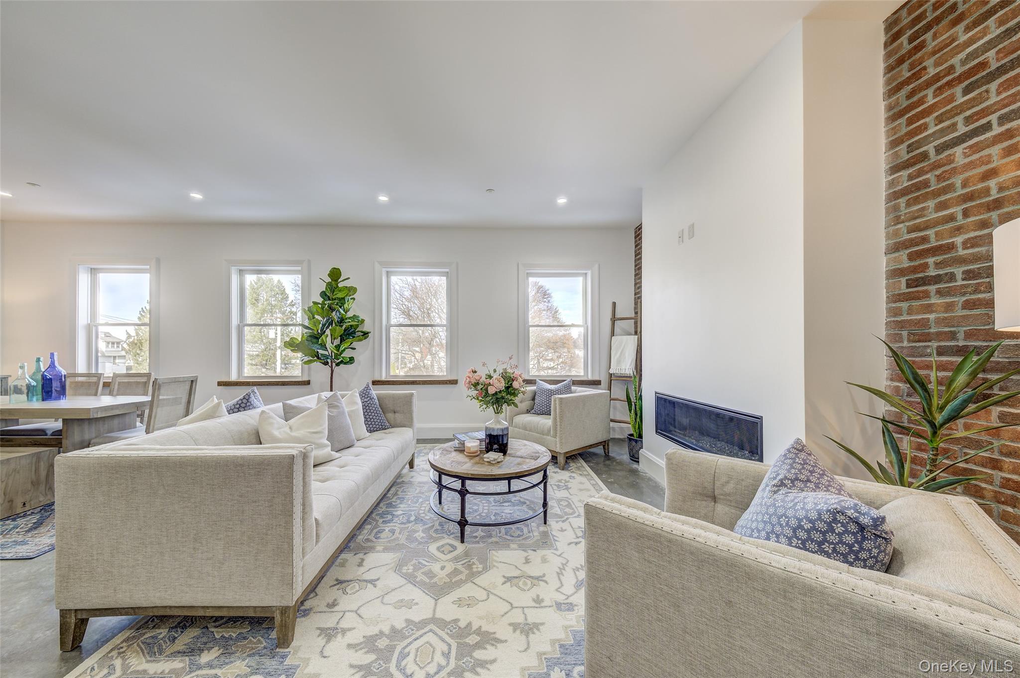 226 Main Street, Unit 302 Beacon, NY 12508 - Photo 5 of 43 Living area featuring recessed lighting and a fireplace