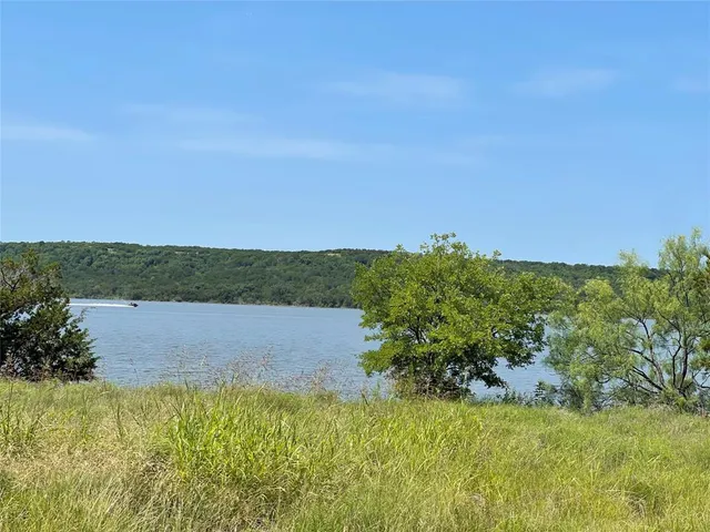 a view of lake with green space