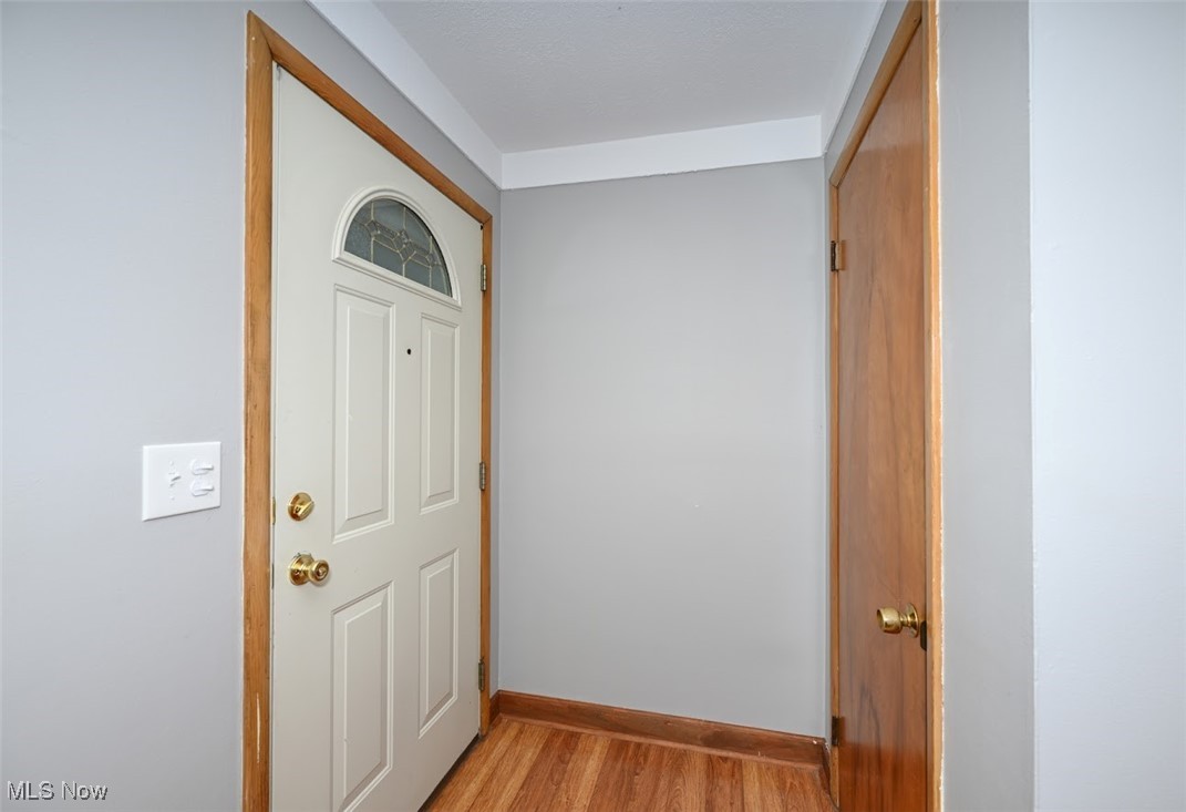13150 Sprague Road Cleveland, OH 44130 - Photo 6 of 39 Entryway with light wood-type flooring and baseboards