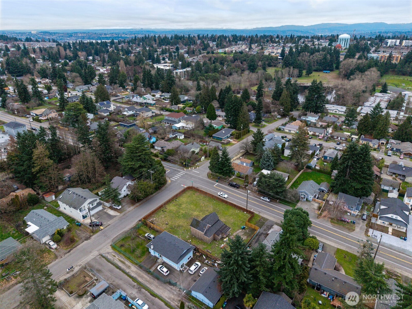 11205 12th Avenue Southwest Seattle, WA 98146 - Photo 24 of 36 an aerial view of a house with a swimming pool outdoor seating and mountain view
