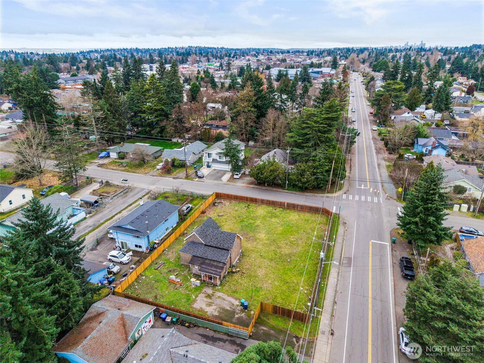 11205 12th Avenue Southwest Seattle, WA 98146 - Photo 31 of 36 an aerial view of a house with outdoor space swimming pool and lake view