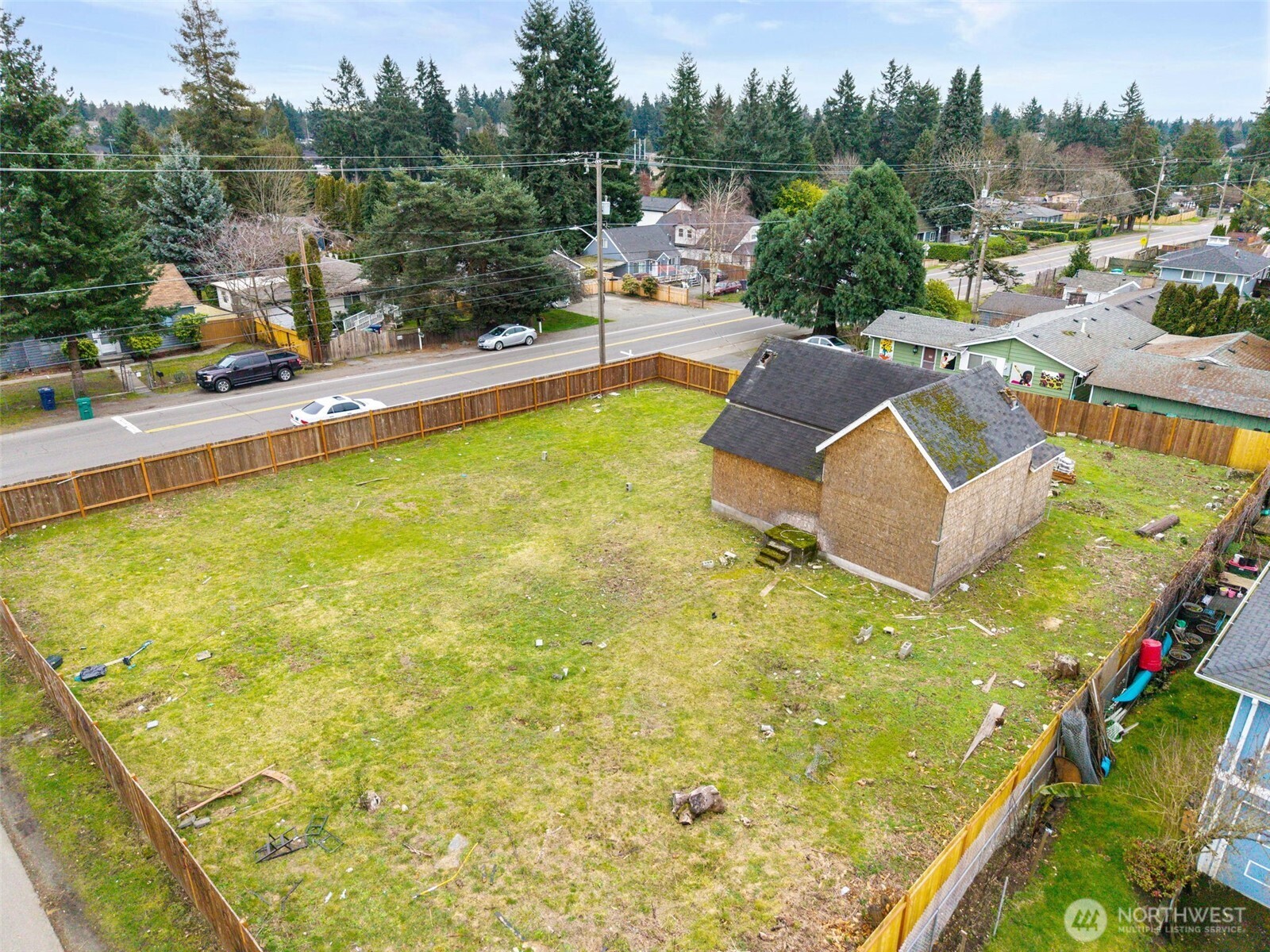 11205 12th Avenue Southwest Seattle, WA 98146 - Photo 7 of 36 a view of a swimming pool with a lawn chairs under an umbrella