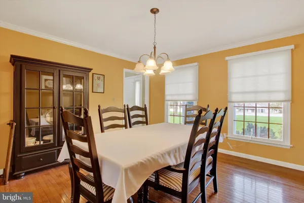 a view of a dining room with furniture and window