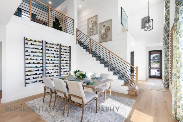 a dining room with furniture and wooden floor