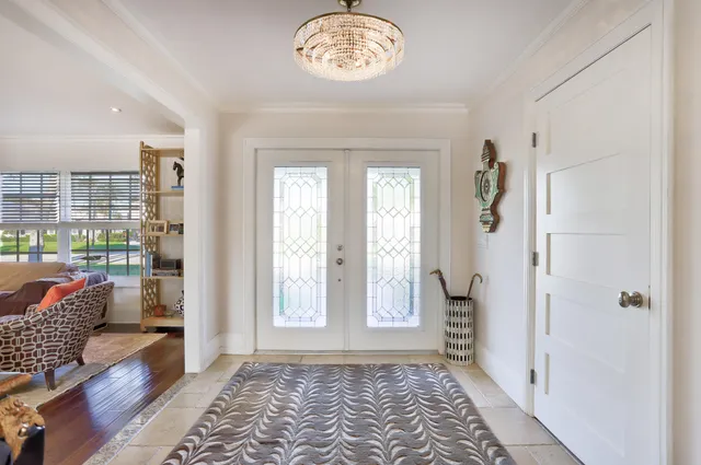 a view of an entryway with wooden floor
