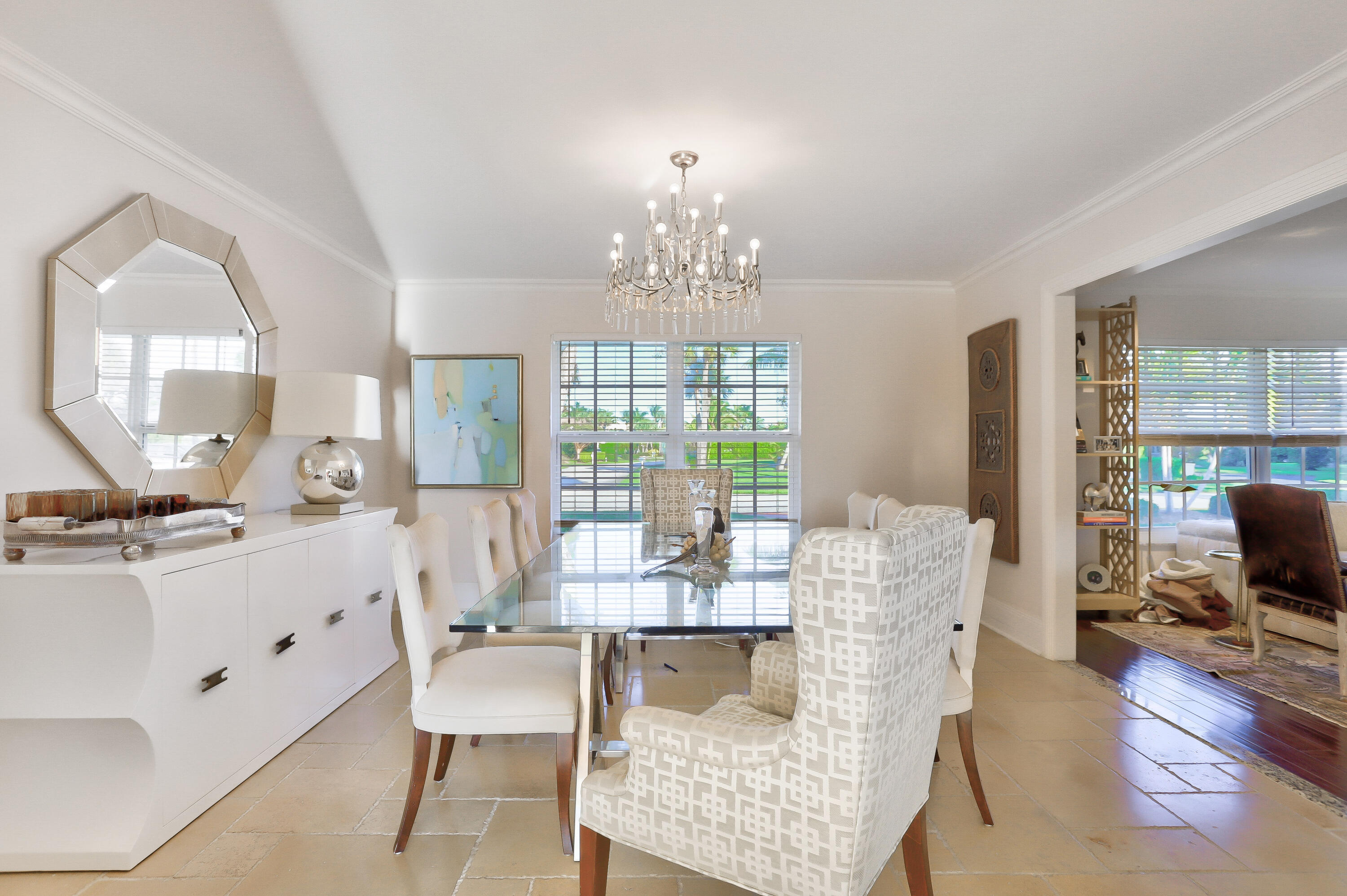835 Canary Walk Delray Beach, FL 33483 - Photo 17 of 42 a view of a dining room with furniture a chandelier and wooden floor
