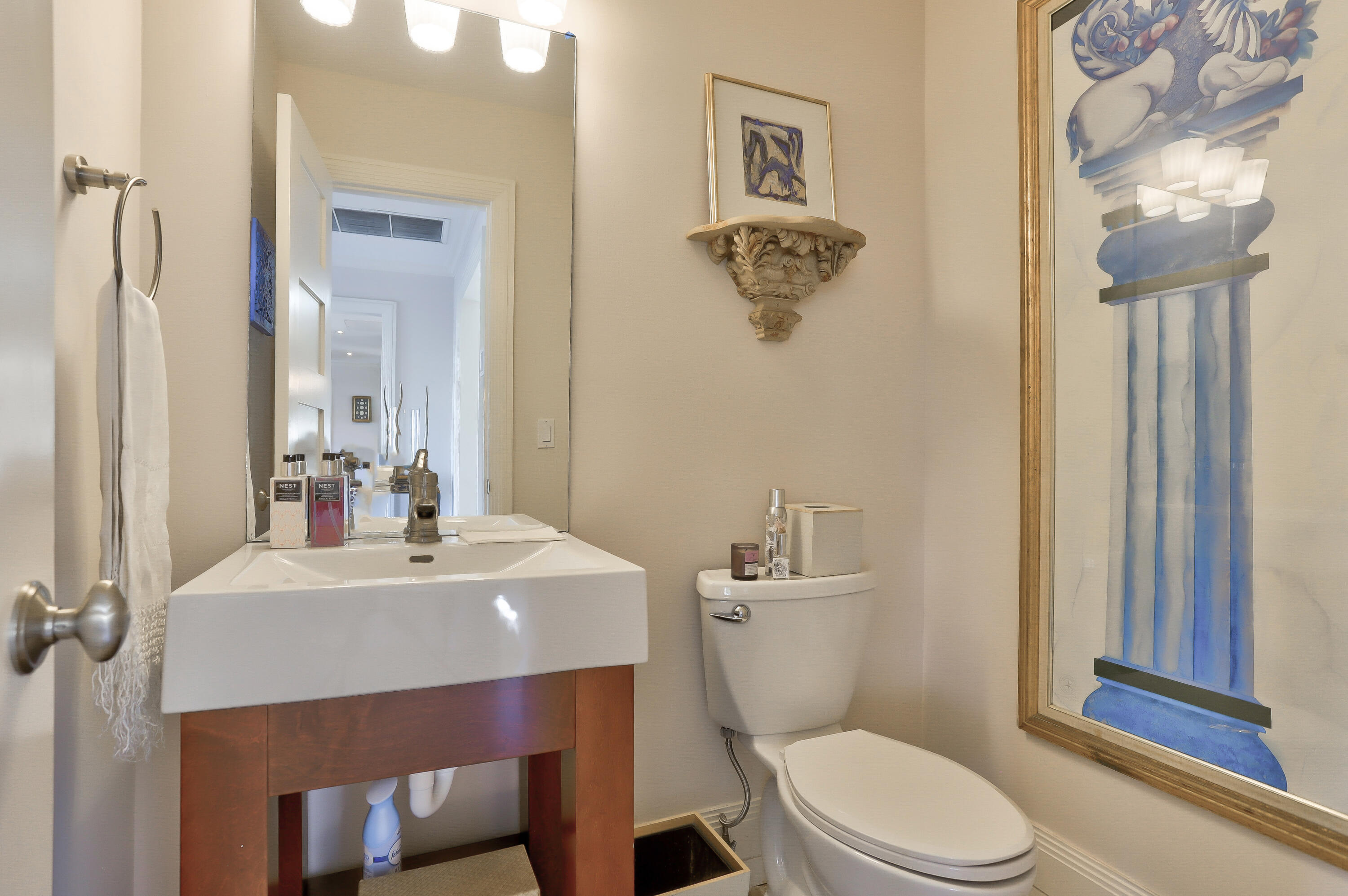 835 Canary Walk Delray Beach, FL 33483 - Photo 26 of 42 a bathroom with a sink a toilet and mirror