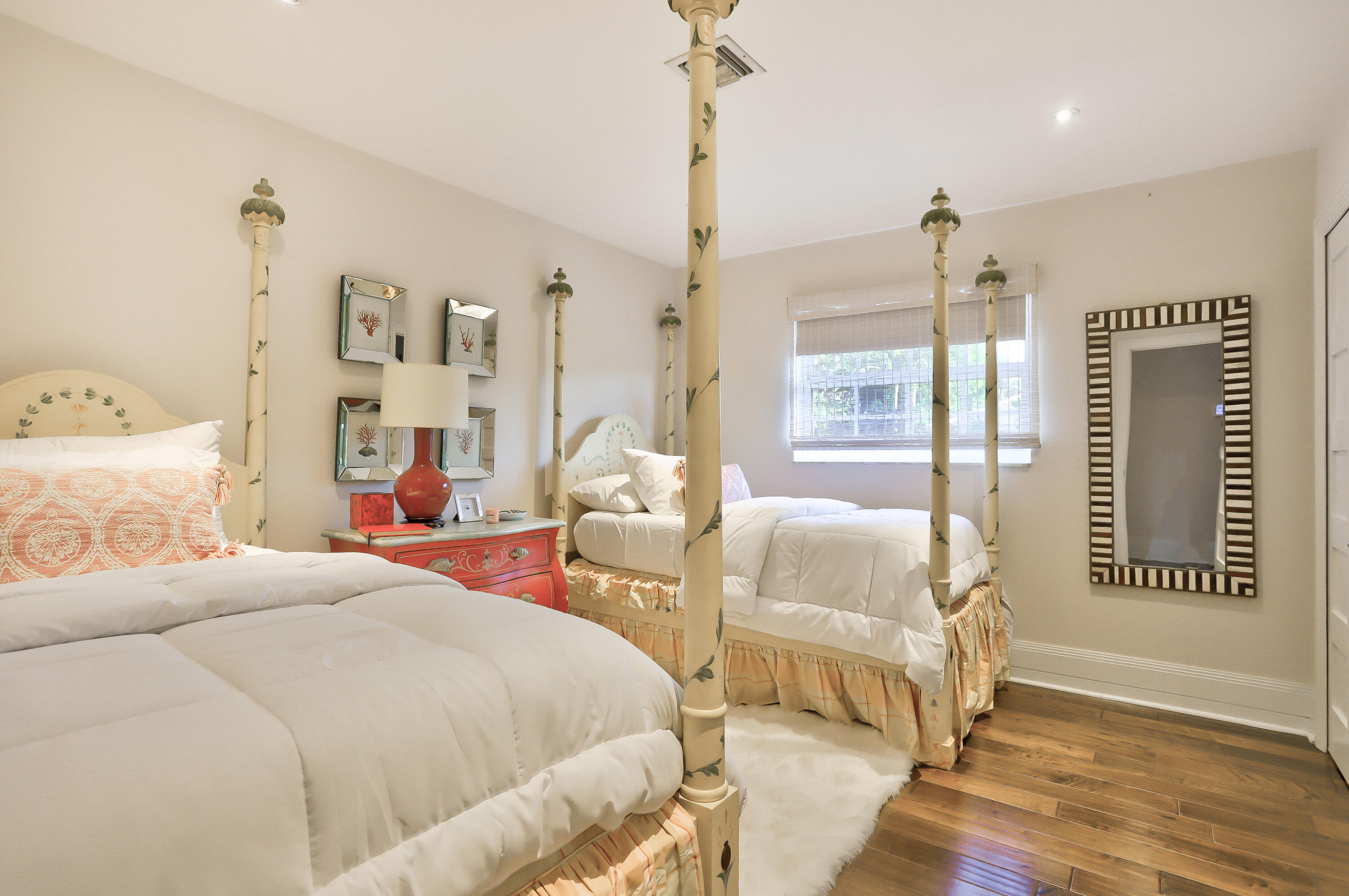 835 Canary Walk Delray Beach, FL 33483 - Photo 27 of 42 a bedroom with a bed and wooden floor