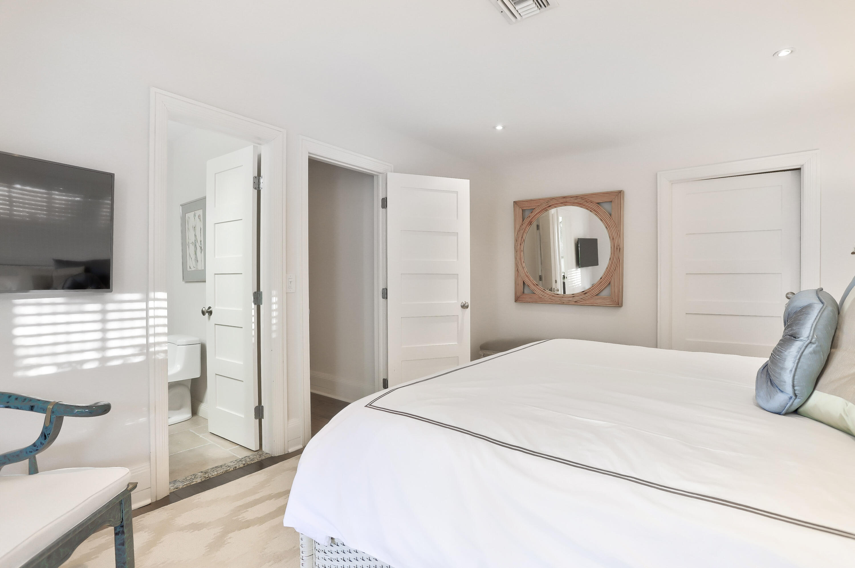 835 Canary Walk Delray Beach, FL 33483 - Photo 32 of 42 a bedroom with a bed and a television