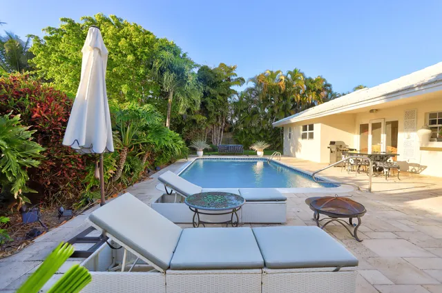 a view of a yard with furniture