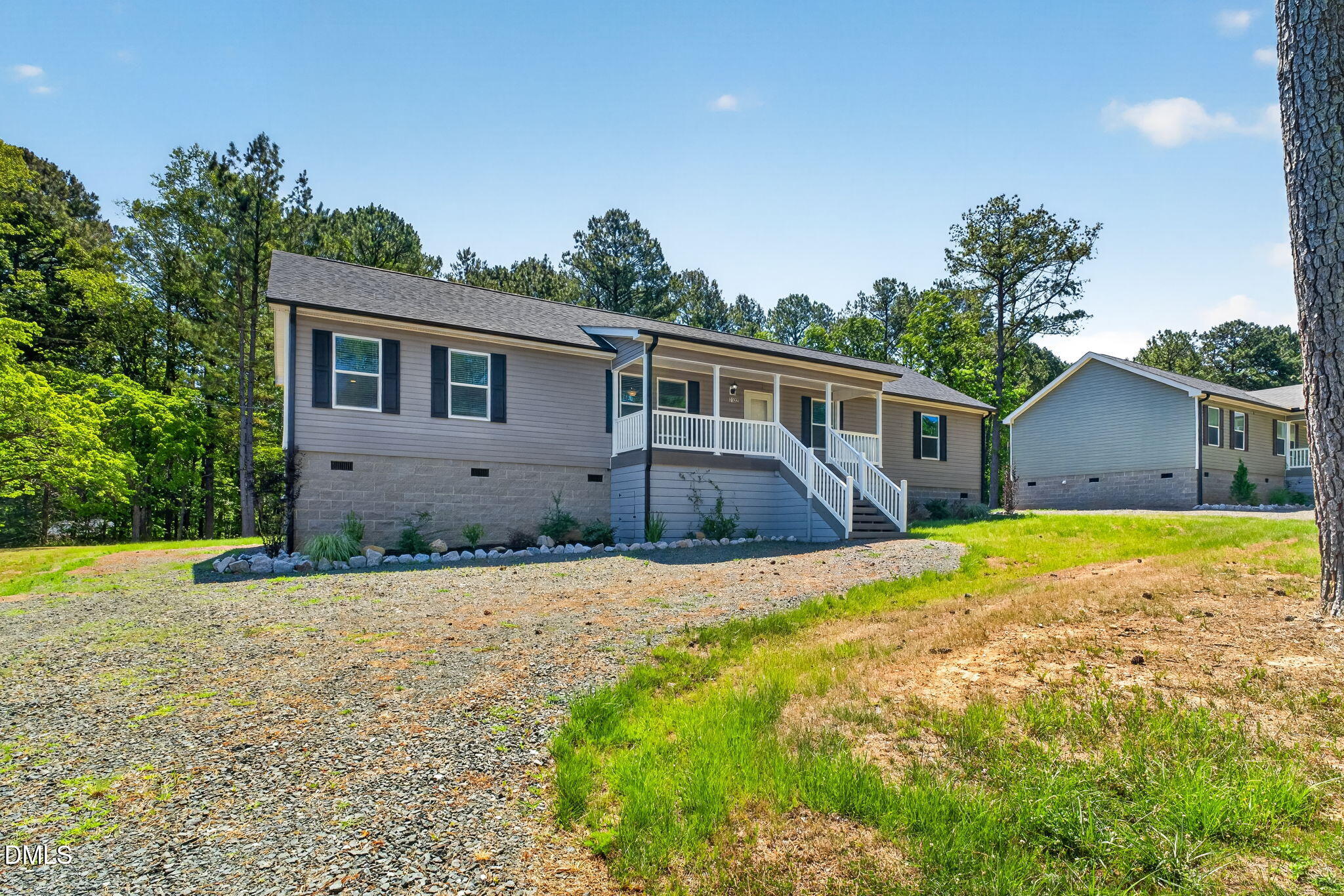 7122 Guess Road Hillsborough, NC 27278 - Photo 19 of 48 a front view of house with yard and trees in the background