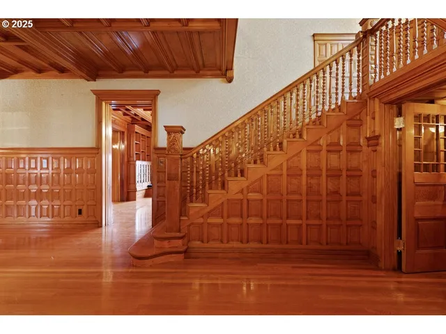 a view of wooden floor with a bathroom