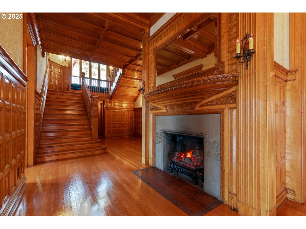1816 Southwest Hawthorne Terrace Portland, OR 97201 - Photo 34 of 48 a view of an empty room with wooden floor fireplace and a window
