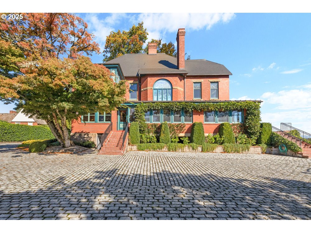 1816 Southwest Hawthorne Terrace Portland, OR 97201 - Photo 8 of 48 a view of a brick house with a yard