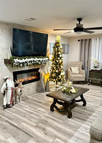 a living room with furniture and a flat screen tv