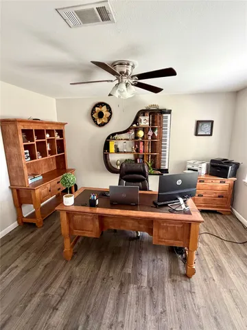 a room with furniture pool table and window