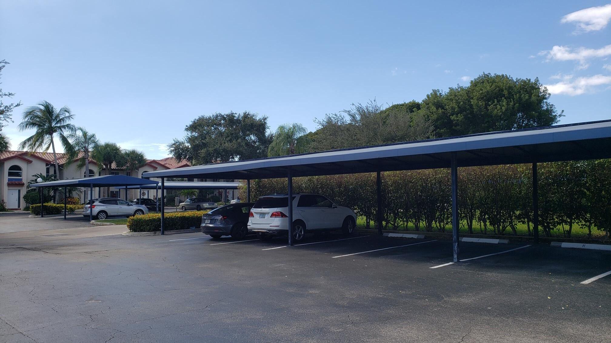 380 Northwest 67th Street, Unit 207 Boca Raton, FL 33487 - Photo 17 of 34 Carport