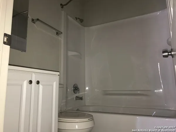 a bathroom with a sink and toilet