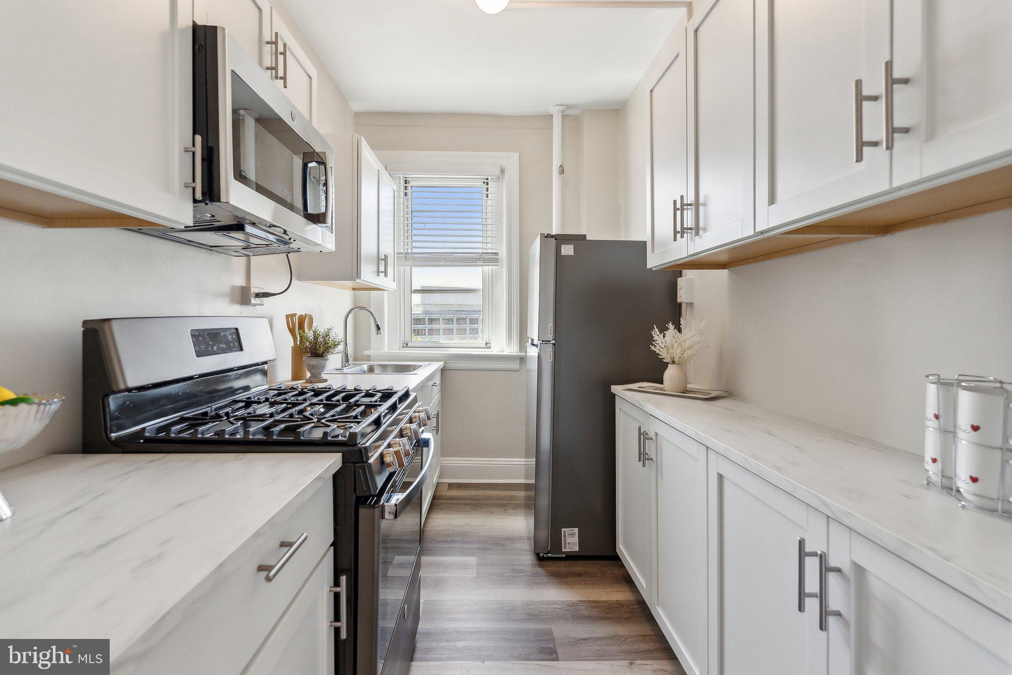 1954 Columbia Road Northwest, Unit 812 Washington, DC 20009 - Photo 5 of 14 BRAND NEW kitchen with stainless steel appliances