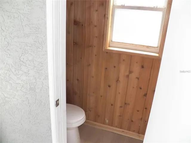 a bathroom with a toilet and a sink