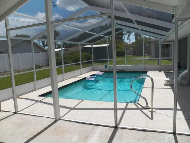 a view of a chairs and table in a patio