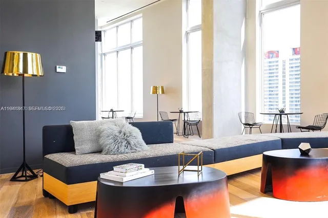 a living room with furniture and a large window