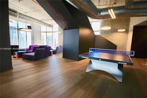 a living room with furniture window and wooden floor