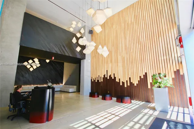 a view of an empty room with a kitchen