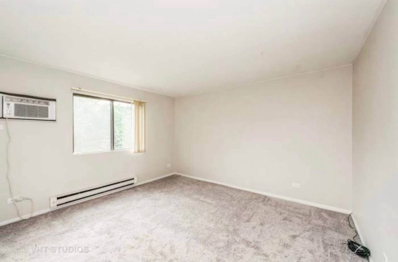 633 South Virginia Road, Unit 214 Crystal Lake, IL 60014 - Photo 8 of 9 an empty room with a window