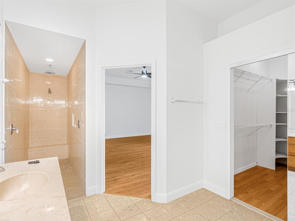 1670 Taylor Ridge Loop Kissimmee, FL 34744 - Photo 15 of 36 a bathroom with a tub shower and sink