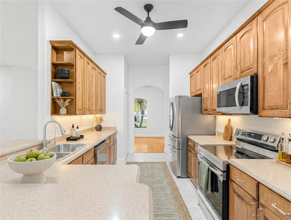 1670 Taylor Ridge Loop Kissimmee, FL 34744 - Photo 20 of 36 a kitchen with a sink appliances and cabinets